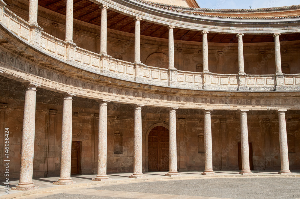 Palace Carlos V, interior circular patio. Rows of columns. Alhambra, Granada, Spain.