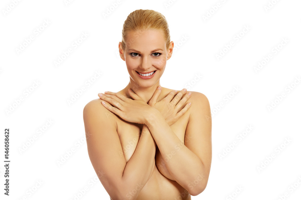 Obraz premium Beautiful topless woman covering her breast