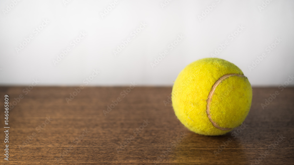 tennis ball on the table on a white background
