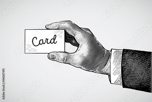 Man's hand is drawn in a engraving style, holding a card.