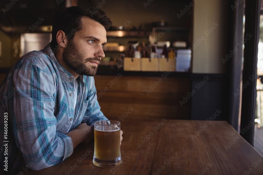 Thoughtful man having beer