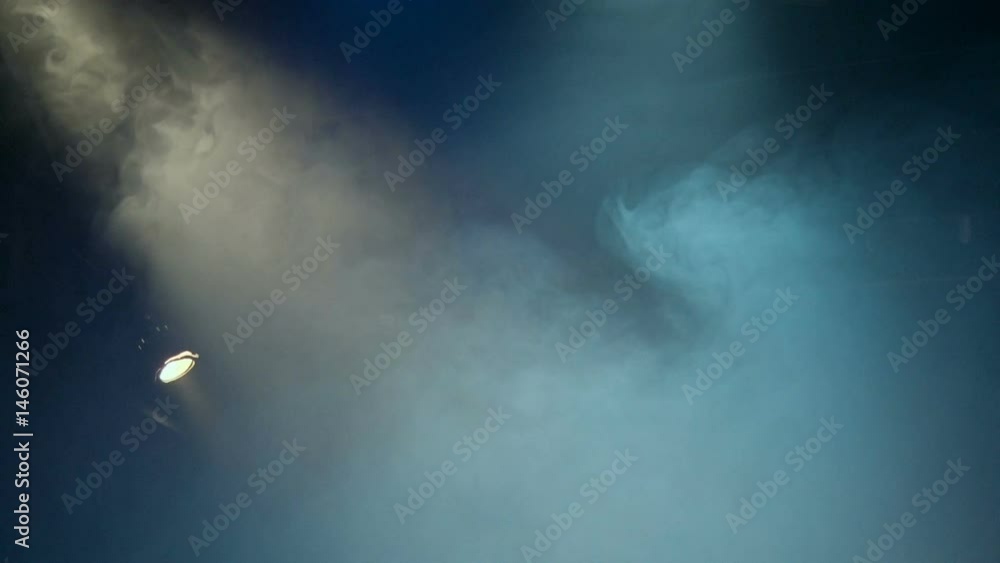 Theatrical smoke. The rays of light from the floodlights at the theater during the performance. Clip looped without gaps. Lighting equipment Theatrical smoke. The rays of light from the floodlights at the theater during the performance. Clip looped without gaps. Lighting equipment