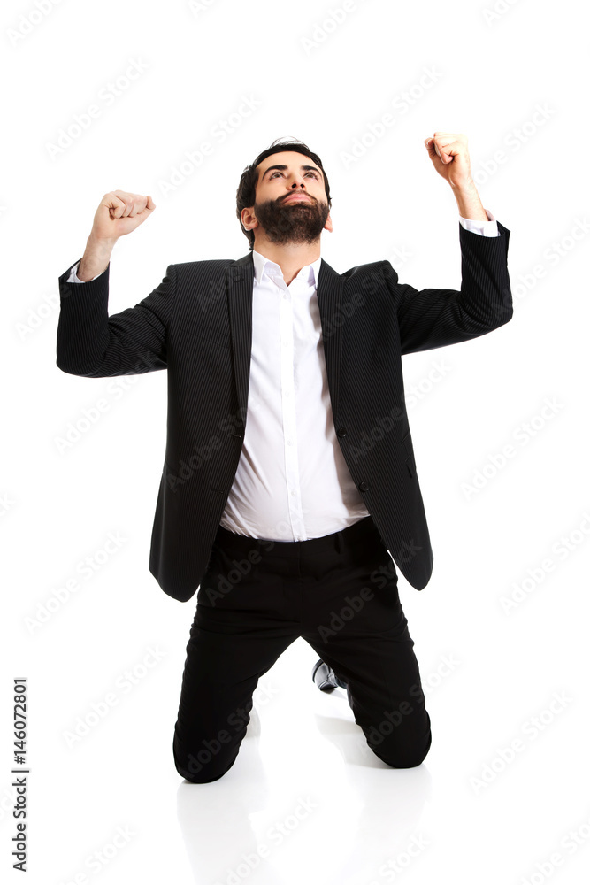 Successful excited businessman making fists. Successful excited businessman making fists.
