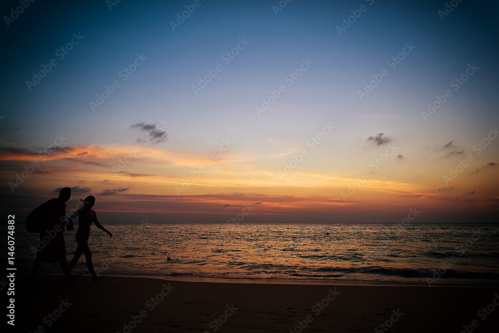  Silhouette young woman on the beach