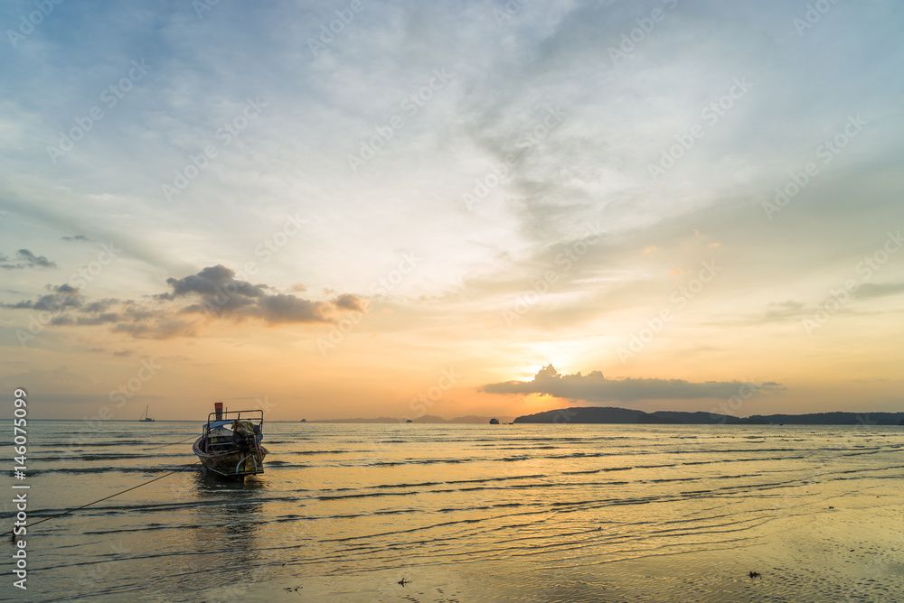 Traditional thai boats at sunset beach. Ao Nang Krabi province