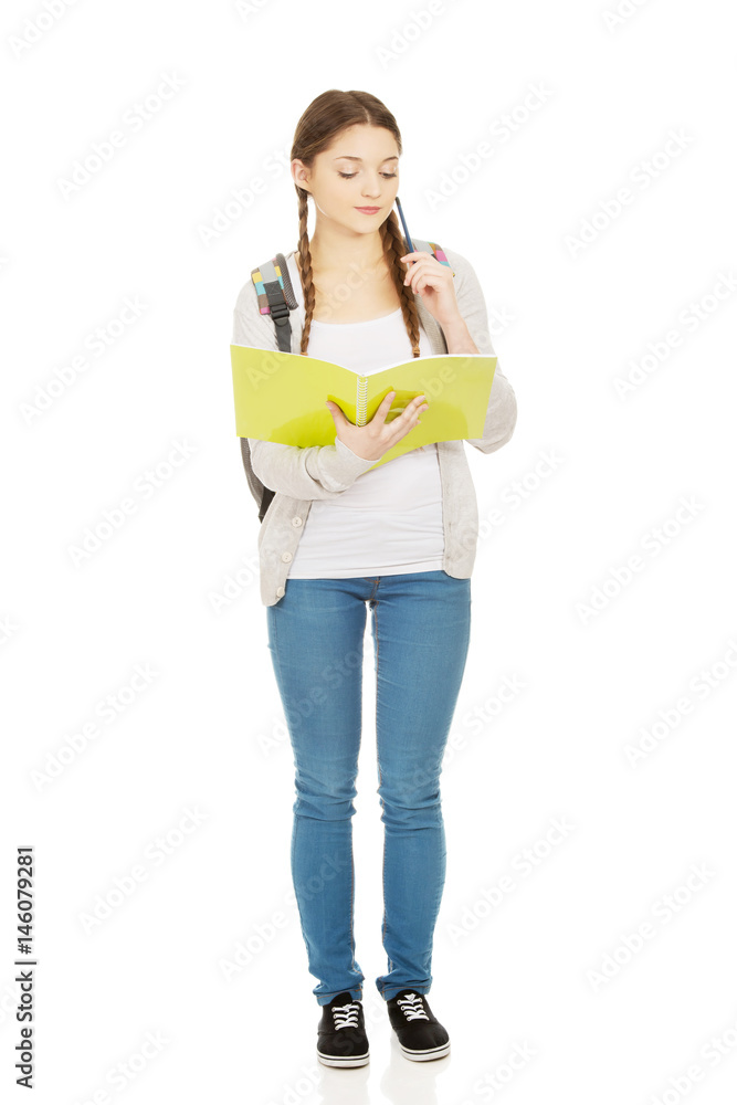 Thoughtful teenager with school backpack. Thoughtful teenager with school backpack.