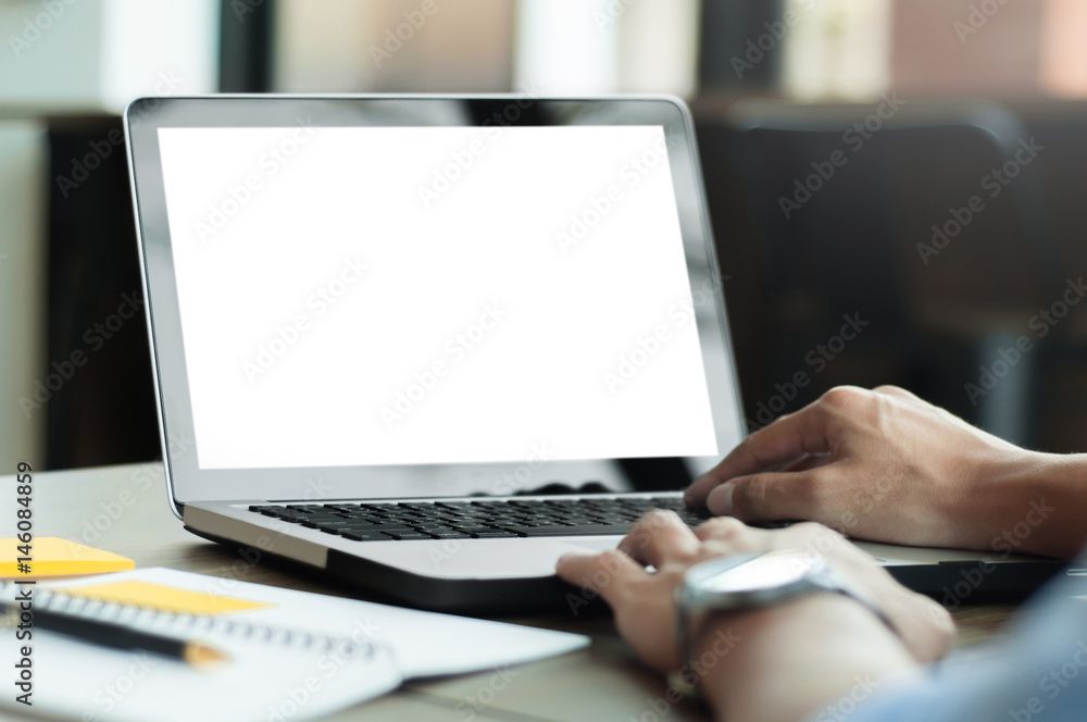 man using laptop with blank screen at modern office man using laptop with blank screen at modern office
