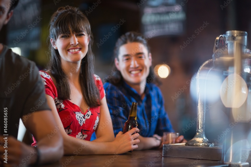 Portrait of smiling friends leaning at counter Portrait of smiling friends leaning at counter