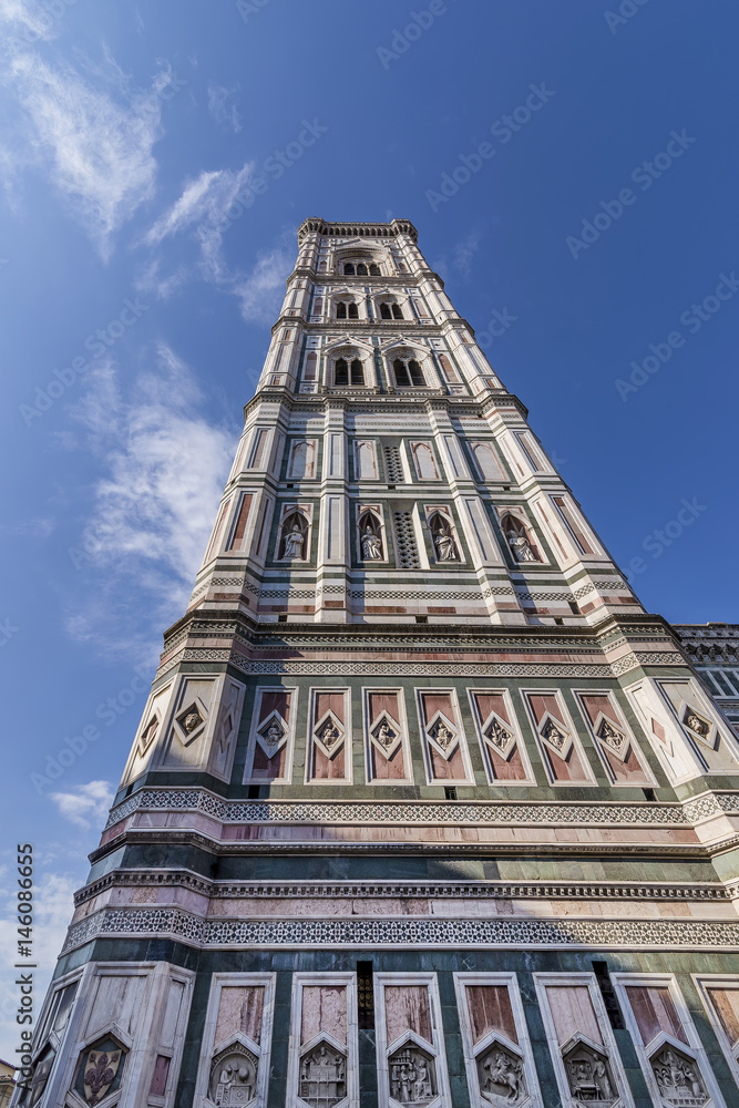 Beautiful bottom view of Giotto's bell tower, Piazza Duomo, Florence, Italy, on a sunny day