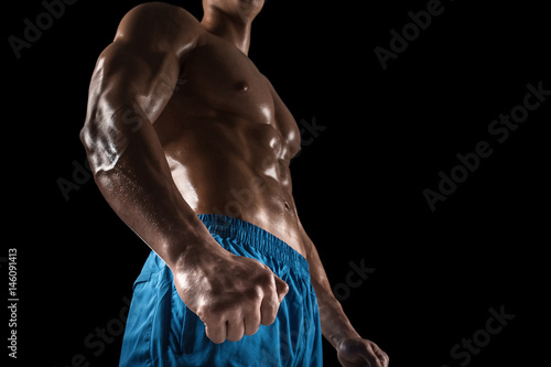 Part of a man's body on a dark background with copyspace