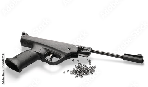Black airgun pistol with pellets isolated on white background photo