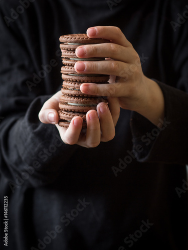 Brown cookies (Chocolate) in the hands