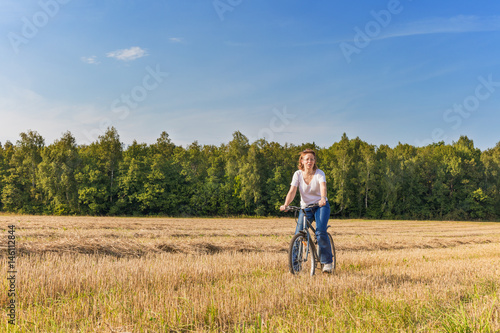 Matured woman on biycle