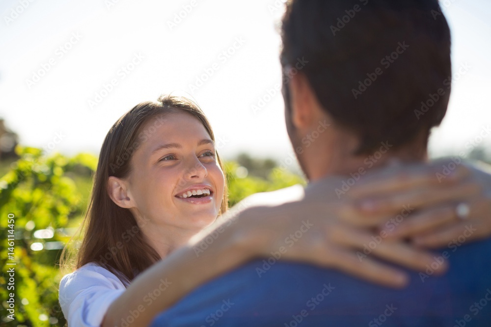 Happy couple embracing at farm Happy couple embracing at farm