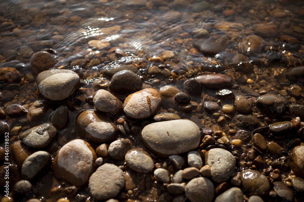 Stone beach on sunset, selective focus Stone beach on sunset, selective focus