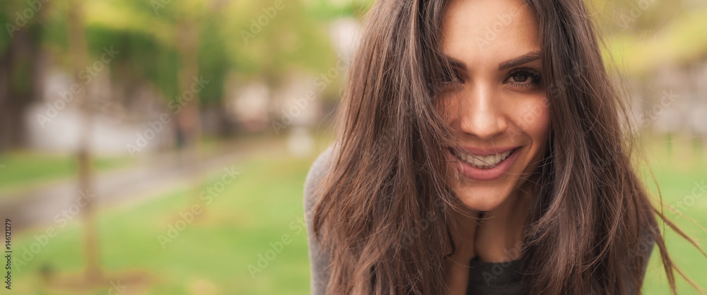 Happy cheerful smiling woman enjoys in the nature. Panorama widescreen Happy cheerful smiling woman enjoys in the nature. Panorama widescreen