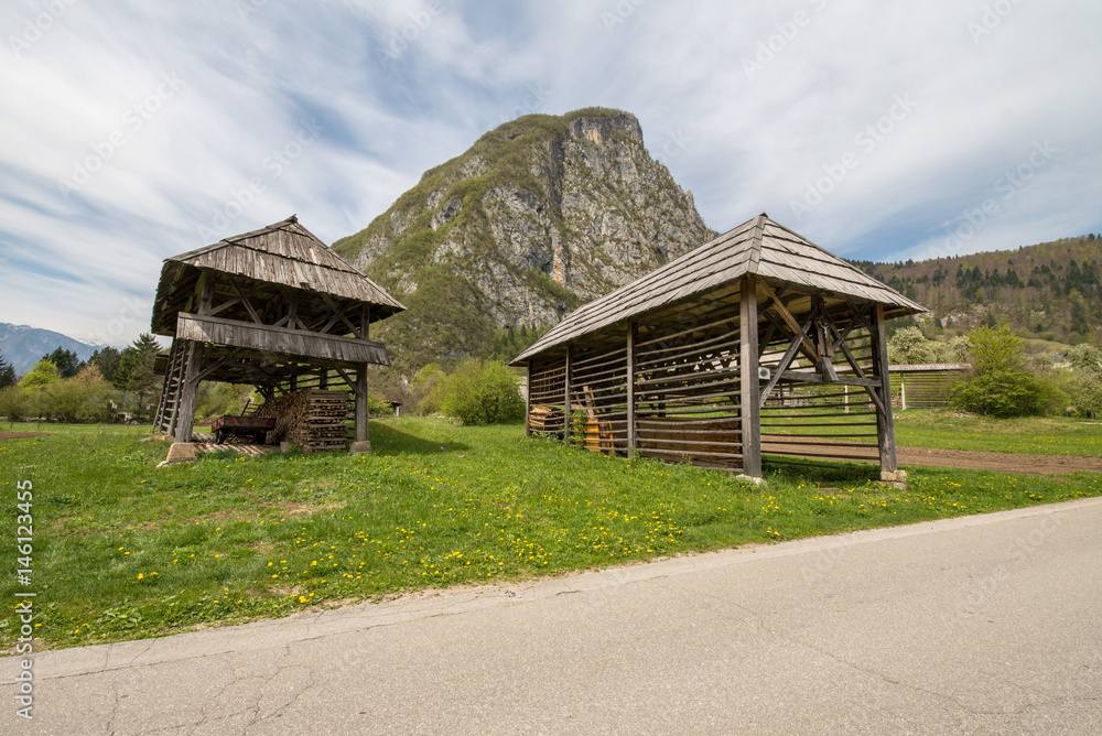 Traditional wooden double hayrack in Bohinj, Slovenia during spring time Traditional wooden double hayrack in Bohinj, Slovenia during spring time