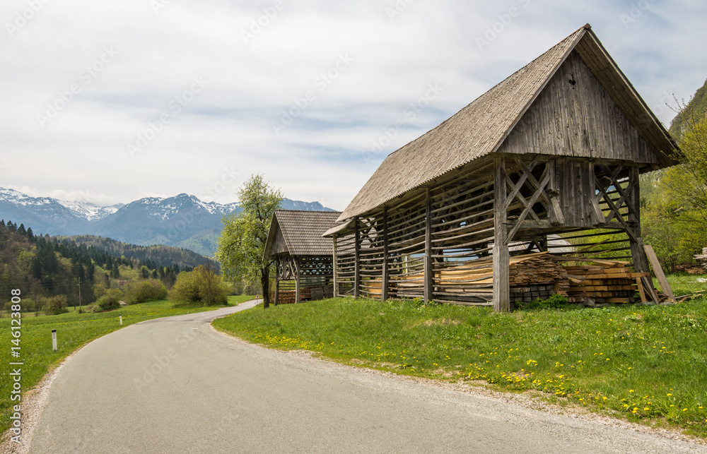 Traditional wooden double hayrack in Bohinj, Slovenia during spring time Traditional wooden double hayrack in Bohinj, Slovenia during spring time
