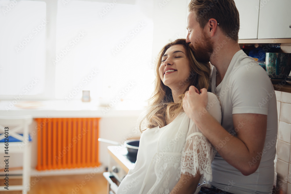 Fototapeta premium Romantic couple speding time together in kitchen