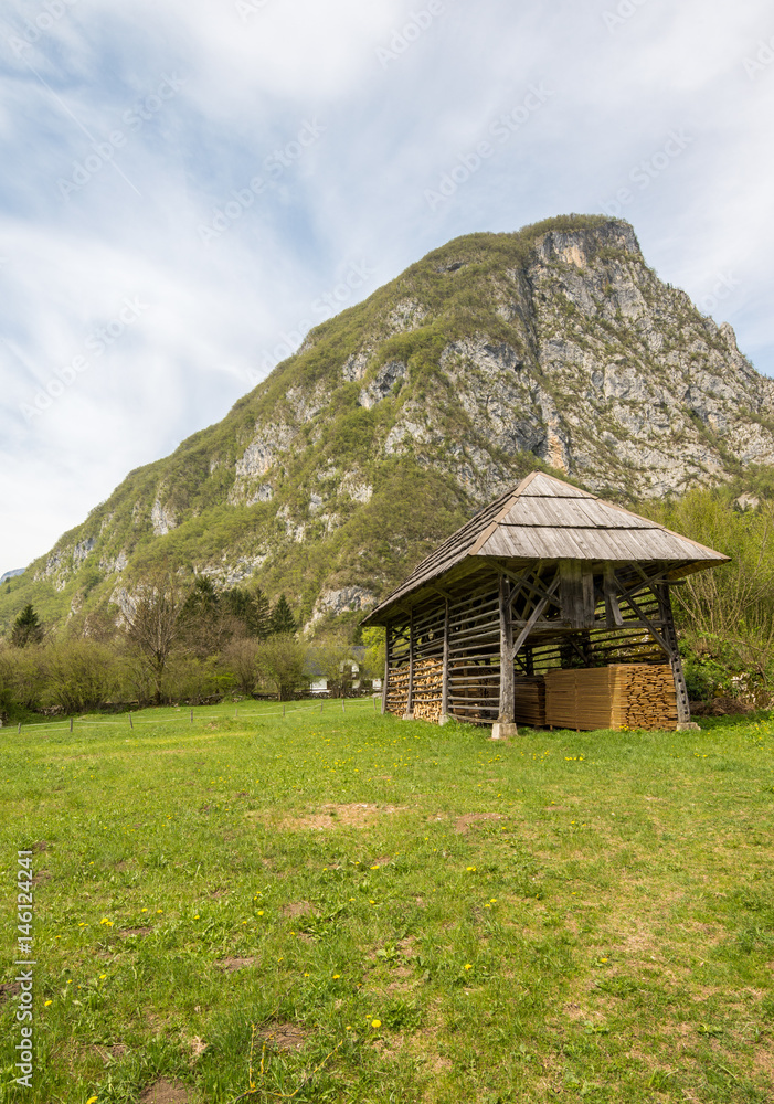Obraz premium Traditional wooden double hayrack in Bohinj, Slovenia during spring time