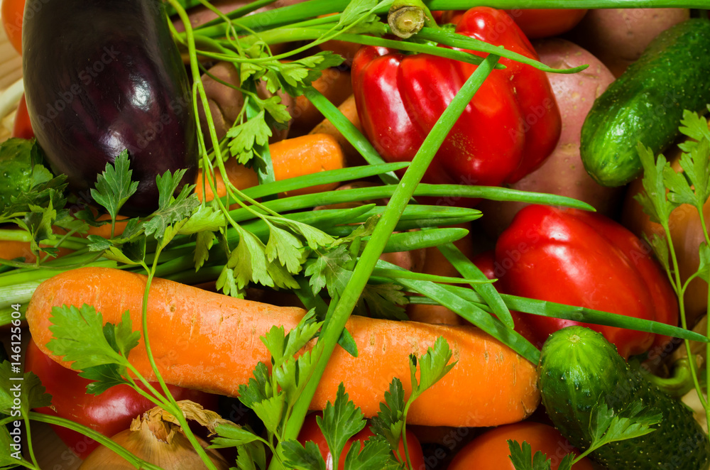 Colorful vegetables on wooden table background. Cooking preparation background. Tomato, pepper, cucumber and over vegetables on the kitchen desk. Colorful vegetables on wooden table background. Cooking preparation background. Tomato, pepper, cucumber and over vegetables on the kitchen desk.