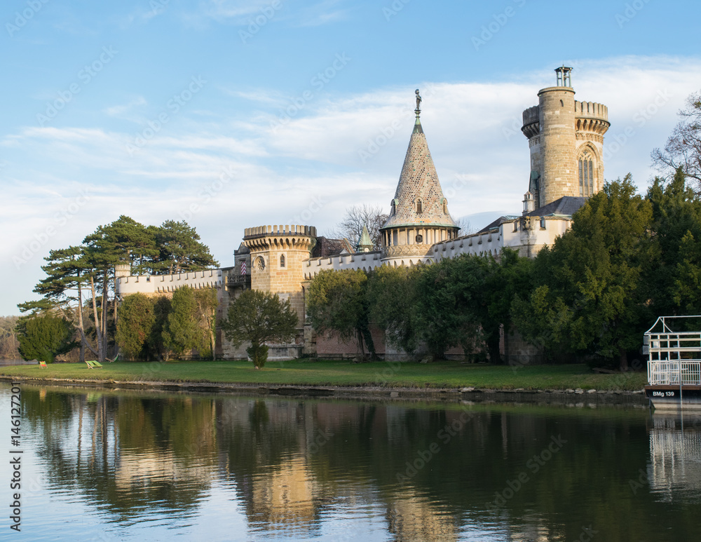 Reflection of Franzensburg Castle in the lakes of Laxenburg outside Vienna, Austria