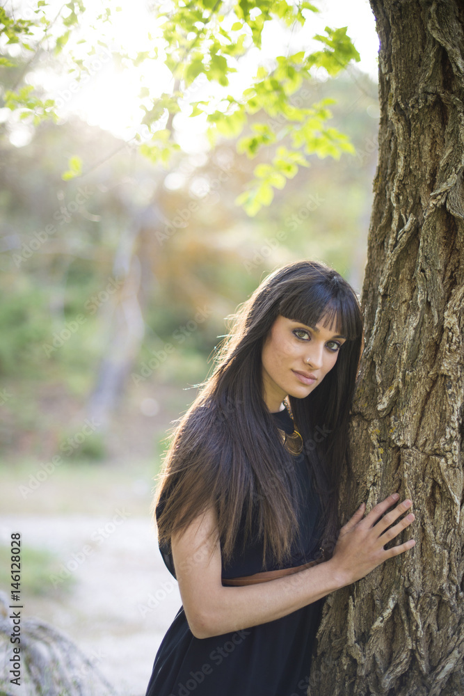 Portrait of young beautiful woman, model of fashion, in nature landscape. Portrait of young beautiful woman, model of fashion, in nature landscape.