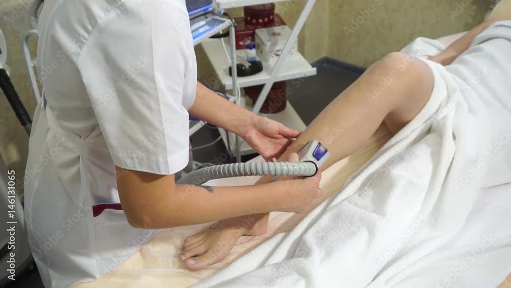 Photoepilation of the legs of a girl in a spa Photoepilation of the legs of a girl in a spa
