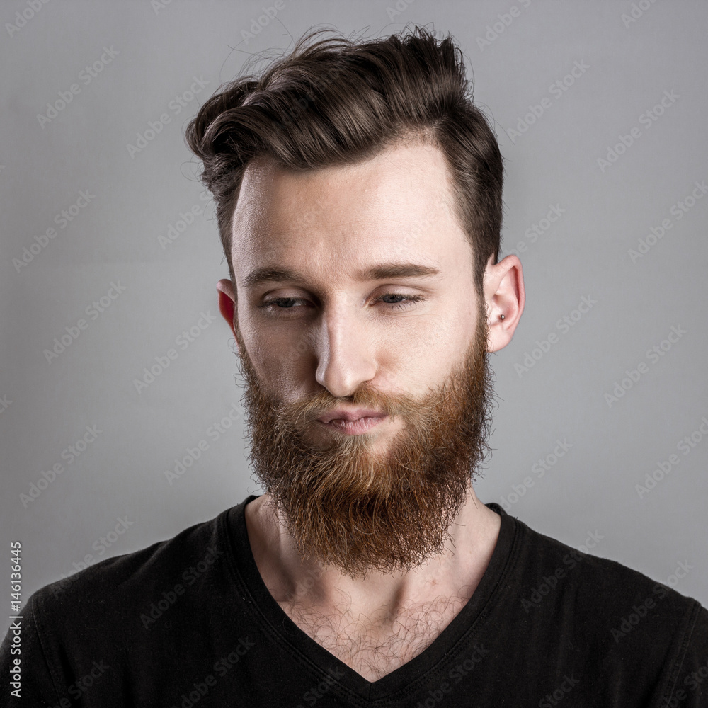 Sad and unhappy young man isolated on gray backround Sad and unhappy young man isolated on gray backround