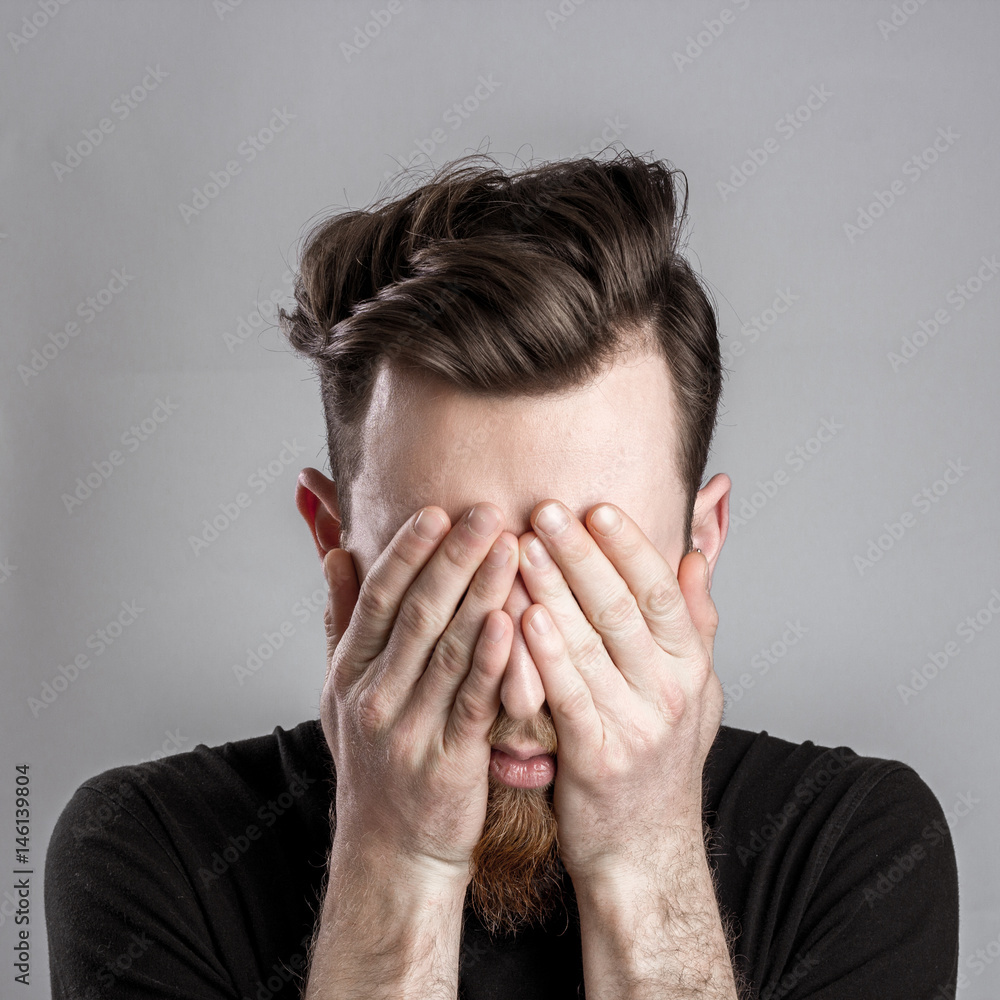 Tired sleepy young man isolated on gray background Tired sleepy young man isolated on gray background