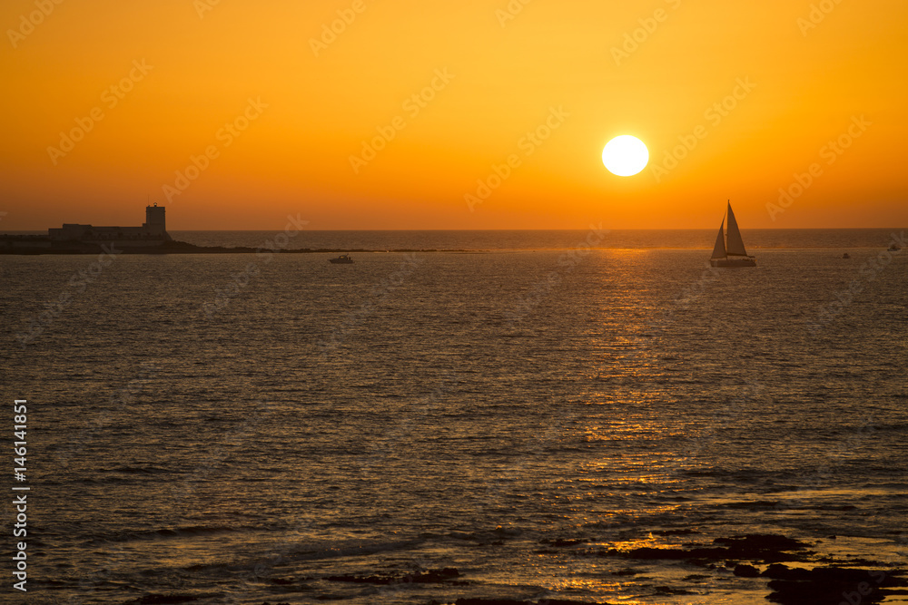 Sail boat in sunset