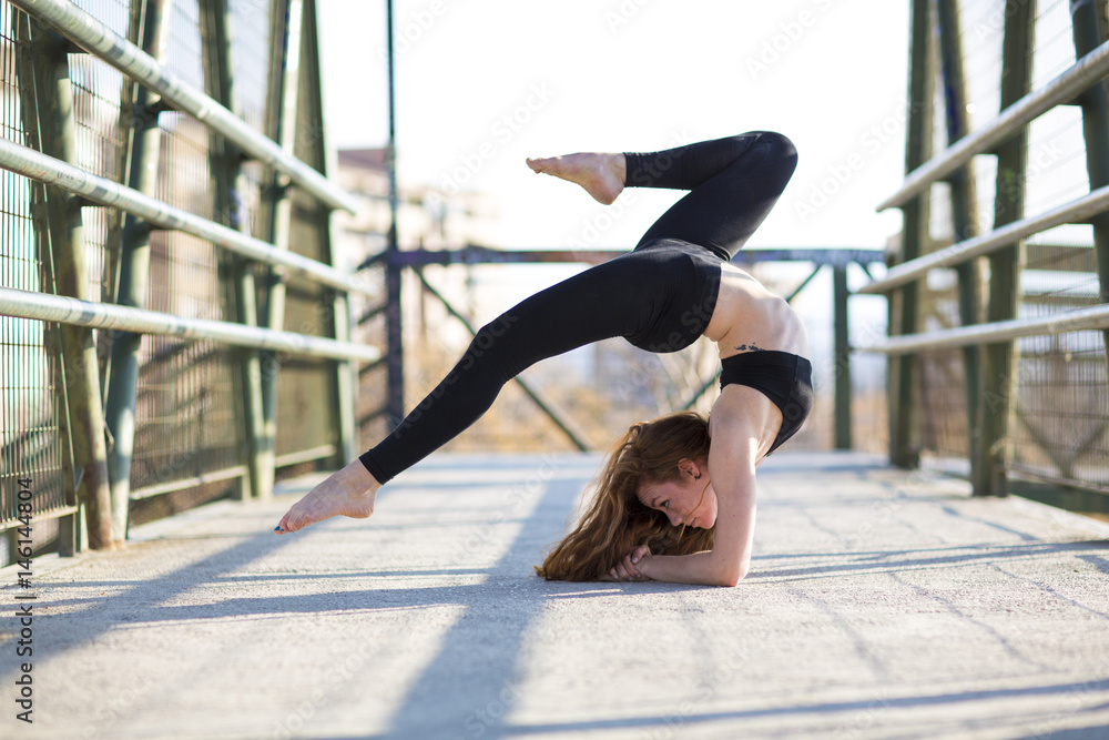 Girl acrobatics on the street.