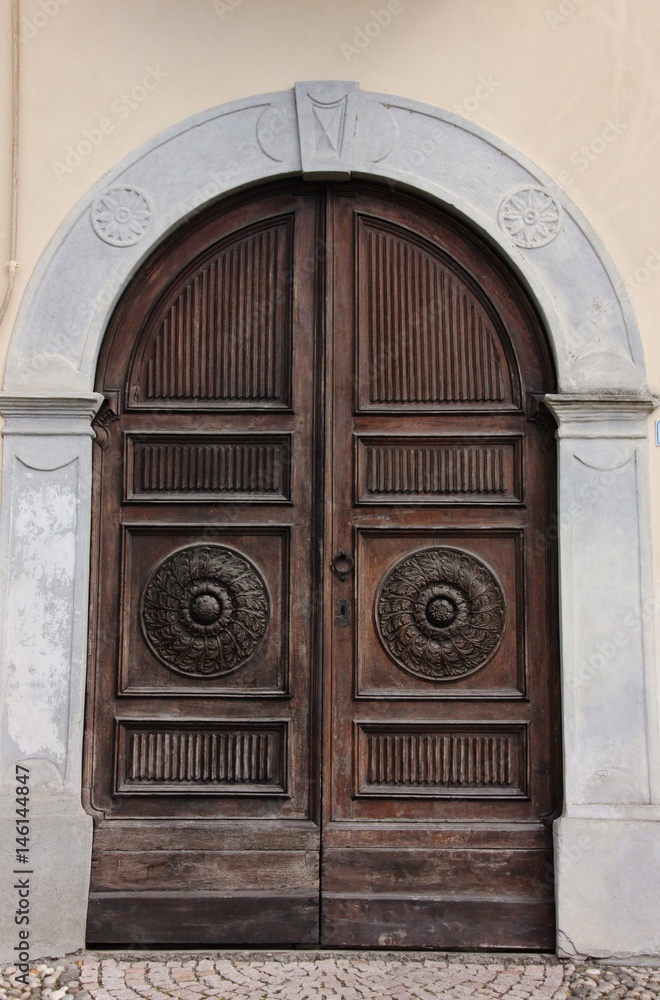 Wooden ancient door in Acqui Terme, Italy