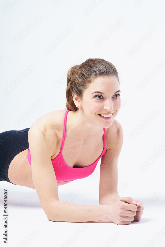 Cute girl performs a handstand - Plank exercise. Cute girl performs a handstand - Plank exercise.