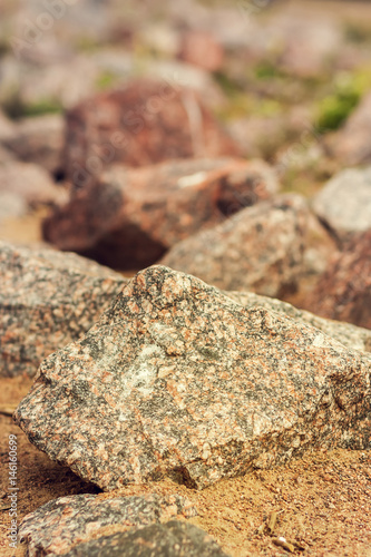A large pile of limestone debris on the seashore.
