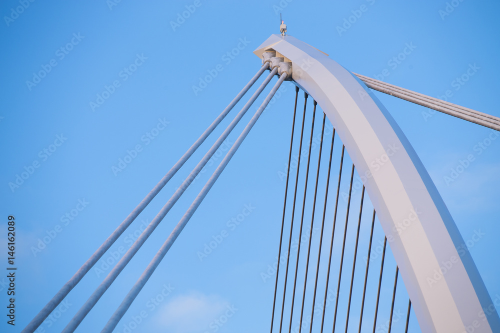 Obraz premium The Samuel Beckett Bridge crosses the Liffey River in Dublin. The structure, designed with a cable-stay method of suspension, is said to resemble an Irish harp.
