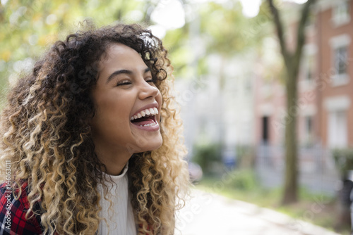 Young woman laughing photo