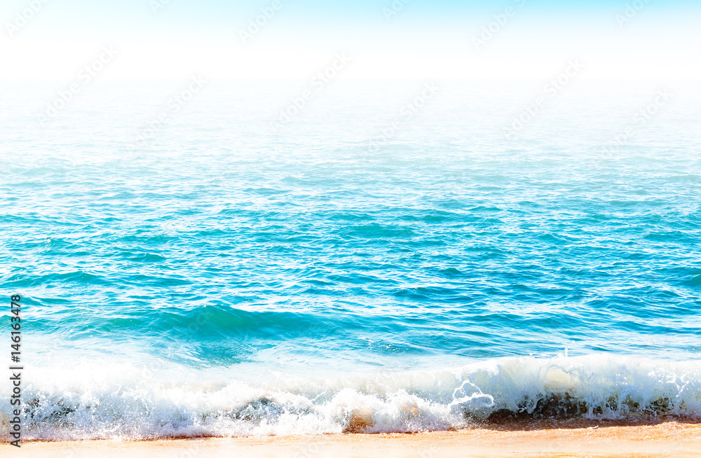 Fototapeta premium Ocean surface with waves near the beach