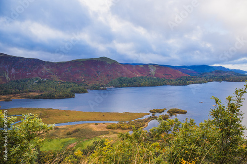 Interesting good view of lake with the mountains and the trees on coast