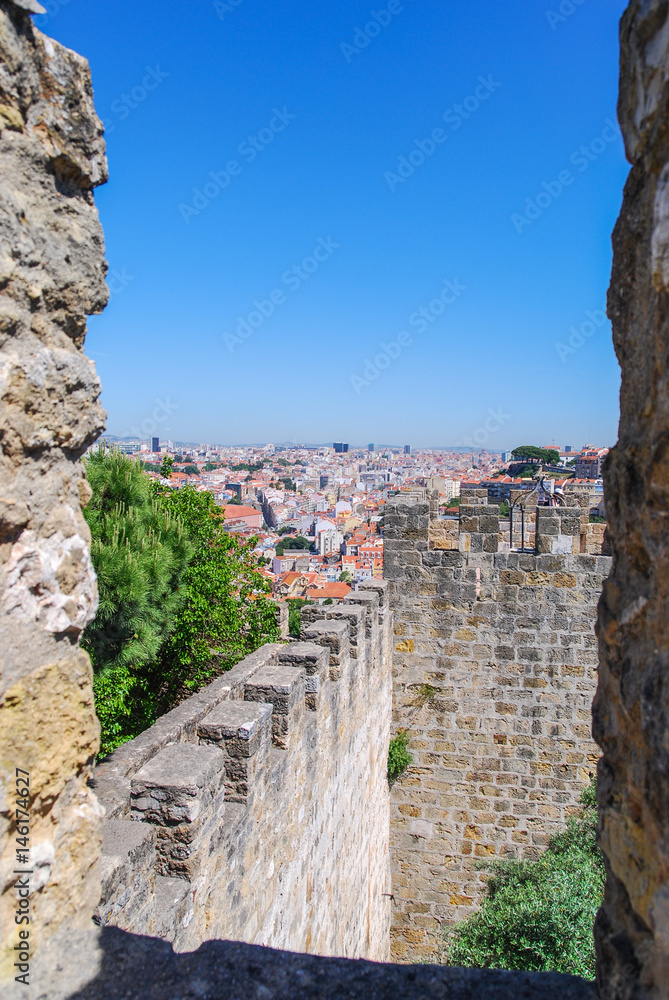 View of Lisbon through ancient fortress portal