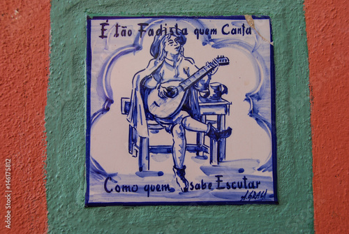 Photos Hand painted azulejo tile showing Fado guitar player