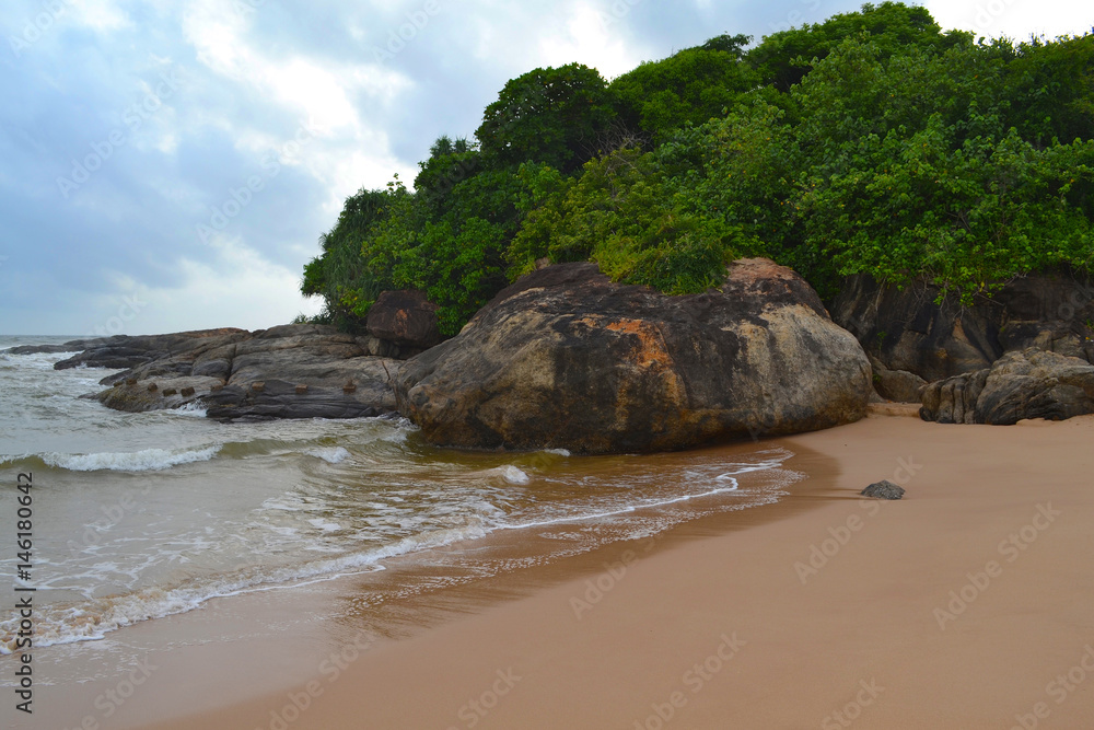 Indian ocean with golden sand, Bentota, Sri Lanka. A wonderful nature landscape of a beach scene. Indian ocean with golden sand, Bentota, Sri Lanka. A wonderful nature landscape of a beach scene.