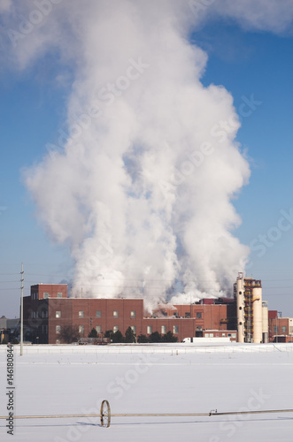 Fotografie Water Vapor Over Processing Plant