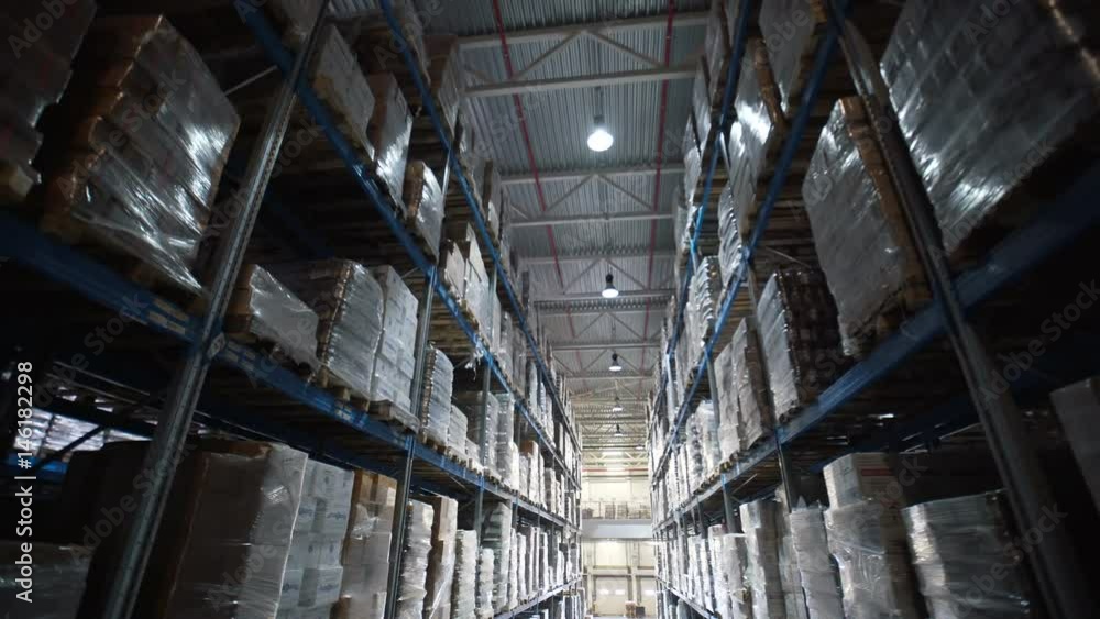 big factory warehouse. store Aisles. Camera travels inside a large store. Warehouse shipping. Logistics business and shipping facility with forklift to move boxes and goods big factory warehouse. store Aisles. Camera travels inside a large store. Warehouse shipping. Logistics business and shipping facility with forklift to move boxes and goods