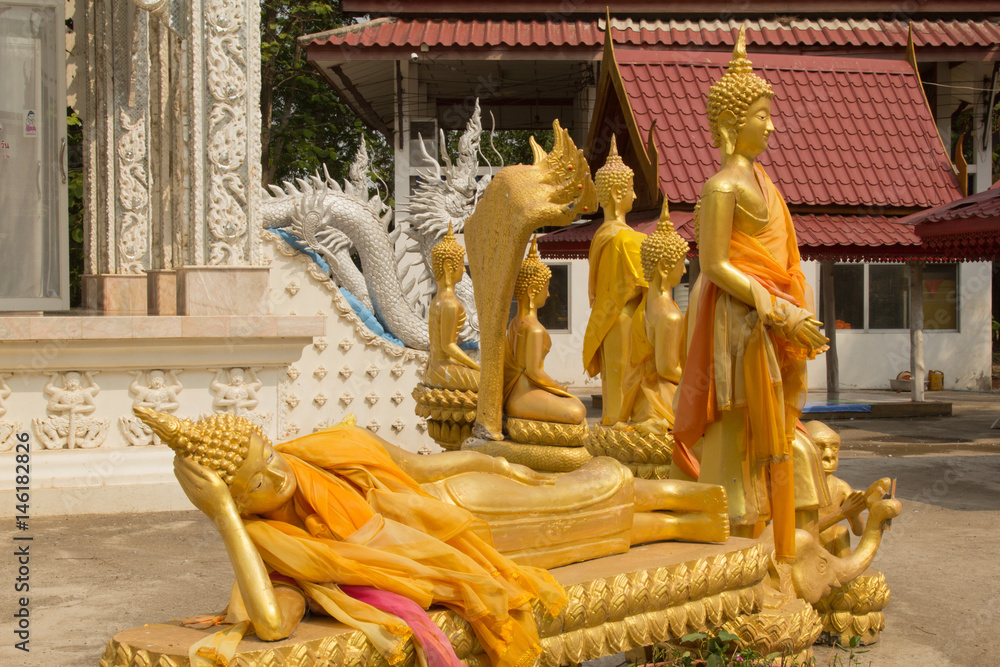 Fototapeta premium Row of golden buddha statue in Wat Mai Kham Wan temple, Phichit,Thailand.