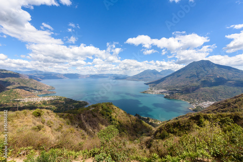 Panorama view to the lake Atitlan with volcanos - small villages San Pedro, San Marcos, San Juan and Panajachel at lake Atitlan in the highland of Guatemala