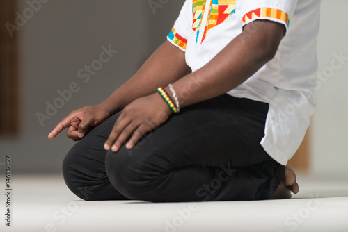 Young African Guy Praying