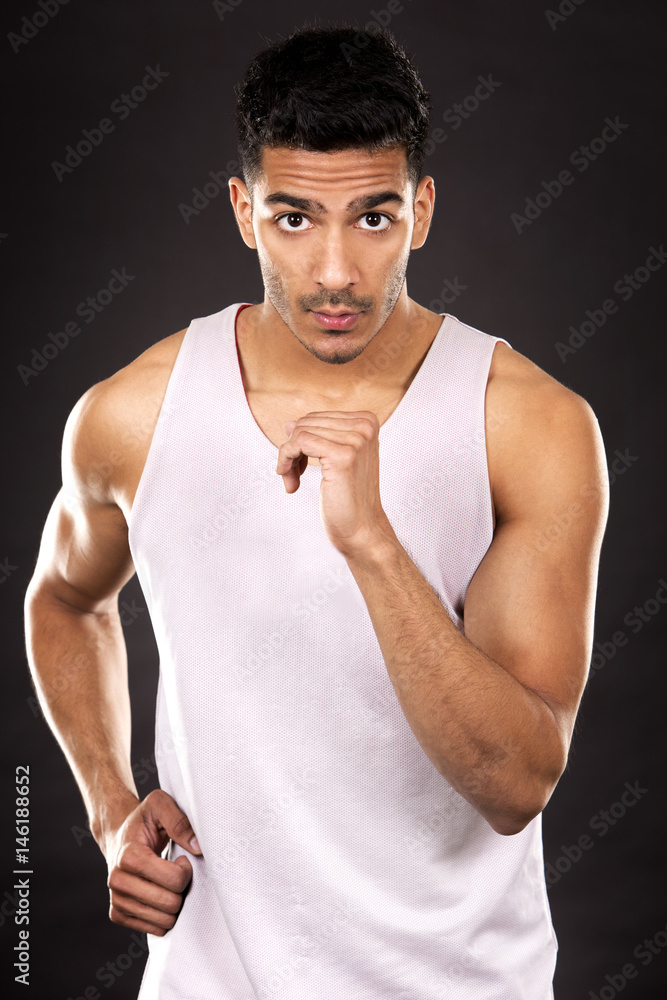 fitness east asian man on dark grey background
