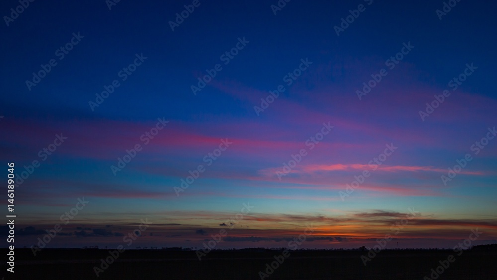 Beautiful vibrant sky over fields in Poland Beautiful vibrant sky over fields in Poland