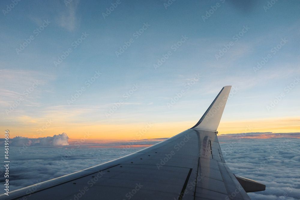 Fototapeta premium Sunrise view at the window of aircraft.